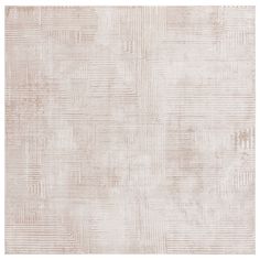 a beige rug with squares and lines on the bottom, in shades of white and light brown