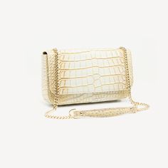 LAUREN has the wow factor you need for all occasions: Alligator leather, BEIGE, semi matte, gold finish. Clutch. This structured silhouette features a beautiful chain with comfortable shoulder guard for all day wear. Has great capacity to fit your mobile phone and all your daily essentials. Wear the Lauren with a variety of looks from day to night and for all occasions. Beige Clutch, Shoulder Guard, Python Bags, Beige Purses, Pink Shoulder Bag, Crocodile Bags, Leather Clutch Bags, Black White Gold, Wow Factor