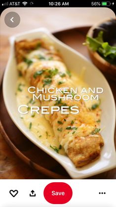 chicken and mushroom crepes on a plate next to a bowl of salad with lettuce