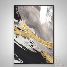 an abstract painting with gold and black paint on the canvas, it is hanging in a room