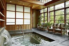 an indoor hot tub with water running from it