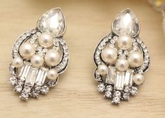 "Bridal Jewellery , Swarovski white pearl and Ivory pearl, Fresh water pearl , Bridal earrrings, wedding earrings, Bridesmaid earrings, wedding jewelry, victorian earrings, pearl & crystal earrings, chandelier earrings ------------------------------------------ This vintage inspired stunning Pearl and Rhinestone earring is beautiful addition to your wedding day. Measures: 1.75\" x 1 \" ( 4.5cm x 2.5cm )nickel-free post backing. Pearl color : - Swarovski white pearl - Swarovski ivory pearl Ea Beaded Crystal Earrings For Wedding, Elegant Beaded Clip-on Earrings For Wedding, Teardrop Beaded Crystal Earrings For Wedding, Silver Beaded Crystal Earrings For Wedding, Wedding Teardrop Beaded Crystal Earrings, Boho Wedding Earrings, Wedding Earrings Studs, Bridesmaid Pearl Earrings, Jewelry Victorian