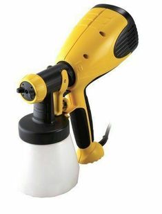 a yellow and black blow dryer sitting on top of a white cup