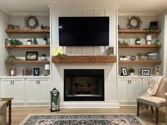 a living room filled with furniture and a flat screen tv mounted on the wall above a fireplace