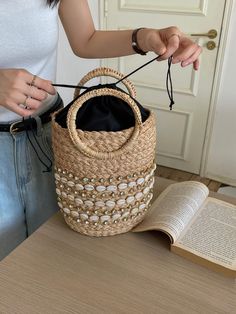 Experience the grandeur of the summertime with the elegantly crafted Elena Handbags Straw Beach Basket. This exquisite basket features intricate detail and durable raffia straw construction, making it the perfect accessory for a stroll on the beach or a sunny picnic. With its timeless appeal, this bag creates a statement of sophistication for any discerning fashionista. Made with raffia strawOpen top with drawstring liningSize: 11"H x 10"W x 5"D Designer Style ID: 8571 Elena Handbags Summer Stra Elegant Bucket Bag With Braided Handles For Beach, Elegant Large Capacity Beach Bag For Vacation, Elegant Tote Bucket Bag For Vacation, Bucket Bag For Beach Season Shopping, Elegant Natural Beach Bag For Beach Season, Elegant Natural Beach Bag For Vacation, Elegant Natural Color Beach Bag For Vacation, Beach Season Shopping Bucket Bag, Elegant Beach Tote Bucket Bag