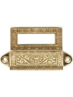 an antique brass door handle with ornate designs