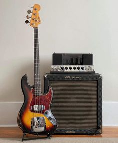 an electric guitar and amp sitting on the floor