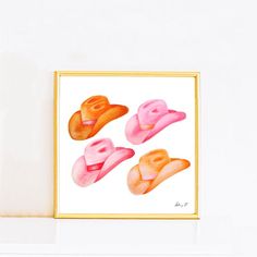 four pairs of pink and orange hats on a white background, framed in gold frame