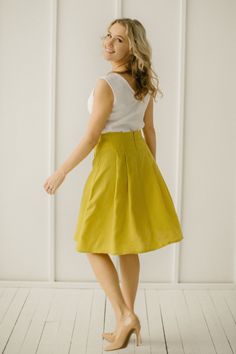 "Yellow Linen Skirt, Linen Retro Skirt, Linen Pleated Skirt Every item is handmade to order and to your personal body measurements (made to measure). DESCRIPTION: -High Waist -Pleats from the waist down -Pockets -Mid Length -Handcrafted Color in the picture- spring yellow and green grey. Other colors are available. ETHICALLY MADE. Every linen garment is handmade using the body measurements of the individual customer. No factory use. Every creative and sewing task is fairly rewarded. Material: 10 Fitted Yellow Wrap Skirt, Elegant Yellow Pleated Skirt, Yellow Knee-length Pencil Skirt, Elegant Knee-length Yellow Bottoms, Elegant Yellow Knee-length Bottoms, Summer Pleated Flowy Pencil Skirt, Yellow Pleated Long Skirt, Flowy Full Skirt Skort With Gathered Details, Yellow Knee-length Lined Mini Skirt