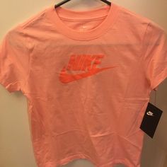 New With Tag Sporty Pink T-shirt With Logo Print, Nike Orange Crew Neck T-shirt, Spring Sports Cotton Shirt, Basic Pink Summer Shirt, Nike Sports T-shirt For Spring, Pink Graphic Print Sports Top, Pink Sports T-shirt With Graphic Print, Spring Pink T-shirt With Logo Print, Cute Pink Sports Tops