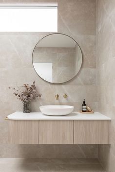 bathroom renovation mistakes to avoid wall hung vanity benchtop basin round mirror coastal style bathroom design with warm tones tiles Neutral Bathrooms Designs, Small Bathroom Styles, Coastal Bathroom Design, Abi Interiors, Coastal Bathroom Decor, Bathroom Mirror Design, Bathroom Vanity Wall, Neutral Bathroom, Beach Bathroom Decor