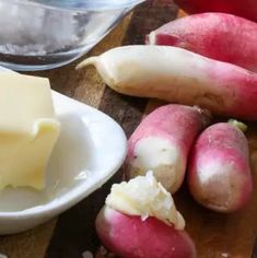 some radishes and butter on a cutting board