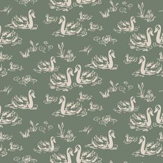 a green and white pattern with swans in the water