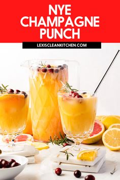 two glasses filled with orange punch and garnished with cranberries