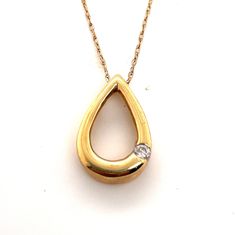 "14K Yellow Gold .10CT Diamond Tear Drop Pear Shape Pendant Comes on a standard 16\" Yellow Gold Chain Weight 2.1 Grams Comes in a Presentable gift box." Pear Shape Pendant, Pear Shaped Pendant, Yellow Gold Chain, Jewellery Collection, Tear Drop, Pear Shape, Pear Shaped, Pendant Necklaces, Gold Chain