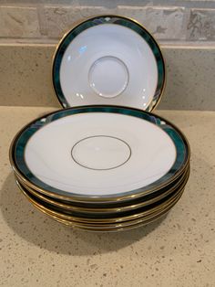 a stack of plates sitting on top of a counter