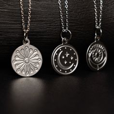 She has fire in her soul and grace in her heart. Introducing our Soul Collection charm necklaces. Set of 3 celestial-inspired charm necklaces – moon and stars, evil eye, and sunburst pendants suspended on delicate sterling silver chains. These enchanting layering necklaces feature celestial and mystical designs and make a perfect gift for stargazers and dreamers alike. Wear each alone or layer them together. These minimalist necklaces will add a touch of cosmic charm to any outfit. Stainle Sterling Silver Medallion Necklace With Charms As Gift, Sterling Silver Celestial Pendant Charm Necklace, Sterling Silver Sun And Moon Spiritual Necklace, Sterling Silver Spiritual Necklace With Sun And Moon Design, Sterling Silver Sun And Moon Pendant Charm Necklace, Spiritual Sterling Silver Necklace With Sun And Moon Design, Spiritual Sterling Silver Sun And Moon Necklace, Sterling Silver Charm Necklace With Sun And Moon Design, Sterling Silver Pendant Necklace With Sun And Moon Design