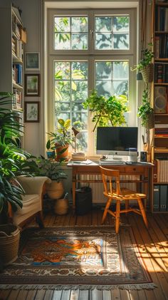 a home office with lots of plants in the window sill, and a rug on the floor