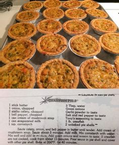 there are many small pies on the baking sheet in the oven, with instructions for how to bake them