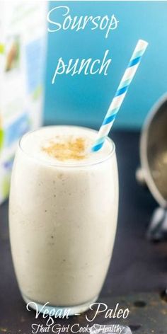 a smoothie in a glass with a blue and white striped straw