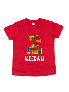 Celebrate your block builders birthday with a custom building blocks birthday shirt! Available in red , white, and black shirts! Customize with any name by writing it in the box below. Also, select their age from the drop-down menu to complete the tee! 100% cotton black, white, & red color options short sleeve length kids, unisex style heat transfer vinyl design printed in Philadelphia, PA Red Short Sleeve Shirt For Birthday, Personalized Red Tops For Birthday, Red Letter Print Tops For Playtime, Red Letter Print Top For Playtime, Customizable Red Tops For Birthday, Red T-shirt With Name Print For Gift, Red Name Print T-shirt For Gift, Fun Red T-shirt For Playtime, Personalized Red Short Sleeve T-shirt