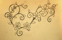 a drawing of two hearts with flowers on the wall behind them, one is drawn in black ink