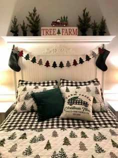 a bed with christmas decorations on the headboard