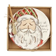 Your days will be jolly and bright with our Santa cheese plate set. The two piece set comes with a ceramic cheese plate. The plate features an image of Santa on the front. The tray features the words "it's the happiest time of the year". The plate also comes with a brass plate and wood spreader. plate 8 1/2" dia | spreader 5 1/2" Mud Pie Kitchen, Santa Faces, Christmas Cheese, Santa Plate, Brass Plate, Pets For Sale, Cheese Plate, Book Dragon, Christmas Nativity