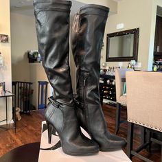 Stylish Knee High Boots Bh Nine West. They Are Light Weight And I Believe Man Made Materials. They Have A Partial Side Zipper Closure And A Back Strap Detail. Perfect Condition And Never Worn. The Heel Measures About 4.5”, The Shaft Is About 17”, And The Opening Is About 17”. Please Feel Free To Ask Me Any Questions. Heel Strap Boots With Round Toe, Leather Knee-high Boots With 4-inch Heel, Fall Boots With Heel Strap And Medium Width, Fall Boots With Heel Strap In Medium Width, Synthetic Boots With Buckle Closure And Pointed Toe, Fall Boots With Heel Strap Medium Width, Black Knee-high Boots With 4-inch Heel, Leather Knee-high Heels With Buckle Closure, Black High Heel Boots With Heel Loop