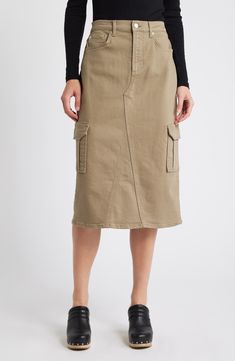 A dark-olive wash and cargo pockets bring a modern-utilitarian aesthetic to this A-line midi skirt cut from cotton stretch denim in a beloved midi length. 29" length (size 29) Zip fly with button closure Front scoop pockets; coin pocket; back patch pockets; cargo flap-patch pockets Back slit Unlined 99% cotton, 1% elastane Machine wash, tumble dry Imported Midi Cargo Skirt, Utility Fashion, Cargo Skirt Outfit, Utilitarian Aesthetic, Olive Skirt, Wallpaper Girly, Latest Skirts, Style Cargo, Work Skirts