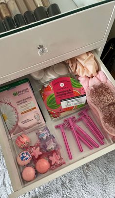 the drawer is filled with lots of different items