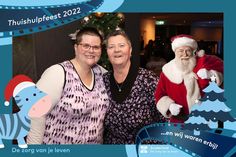 two women standing next to each other in front of a christmas tree with santa clause on it