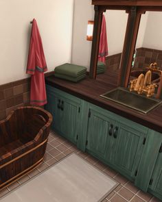 a bath tub sitting next to a sink in a bathroom under a mirror with red towels hanging on it