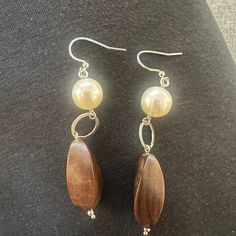 Elevate Your Style With Our Stunning Pearl And Wood Dangly Earrings! These Unique Earrings Beautifully Blend The Elegance Of Lustrous Pearls With The Earthy Warmth Of Polished Wood. Each Piece Is Handcrafted, Ensuring That No Two Earrings Are Exactly Alike. The Gentle Sway Of The Dangling Design Adds A Touch Of Movement And Sophistication To Any Outfit, Making Them Perfect For Both Casual Days And Special Occasions. Lightweight And Comfortable, These Earrings Are Designed For All-Day Wear. The N Two Earrings, Wood Dangle Earrings, Polished Wood, Wood Polish, Outfit Making, Dangly Earrings, Unique Earrings, Favorite Jeans, Natural Materials