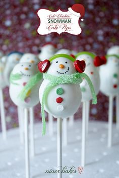 cake pops decorated like snowmen on a stick