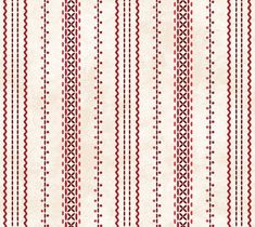 a red and white striped wallpaper with small circles on the bottom half of it