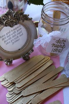 the diy bridal shower decor is displayed in front of a jar with wooden clothes pins