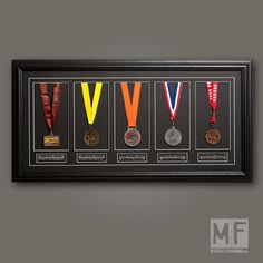 a framed medal display with medals hanging on the wall