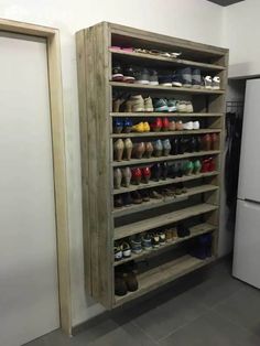 a large shoe rack in the corner of a room