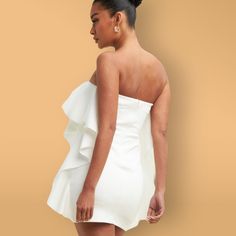 Make a statement at any special event in the When Doves Cry Mini Dress. This white ruffle bandeau mini dress is the perfect blend of sophistication and elegance. Crafted with premium materials and attention to detail, this dress will have you feeling glamorous and chic. Steal the show and make a lasting impression at your next event in this timeless piece. Bandeau Mini Dress, White Outfits, Online Accessories, Timeless Pieces, Special Event, Special Events, Cool Style, How Are You Feeling, Mini Dress