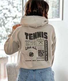 Step onto the court in style with our exclusive Tennis-themed Collage Hoodie. Crafted for comfort and designed for tennis enthusiasts, this hoodie features a unique collage on the back capturing the essence of the sport.  Made with soft, premium materials, this hoodie ensures warmth and style whether you're on or off the court. A perfect blend of athletic spirit and streetwear fashion, this Tennis Collage Hoodie is a must-have for anyone who loves the game. Serve up style and snag yours today! . Sports Hoodies Design, Cute Sweatshirts Aesthetic, Tennis Spirit Wear, Tennis Streetwear, Hoodie Back, Hoodie Back Design, White Sweatshirt For Tennis Sports Season, Sports Fashion, Tennis Design