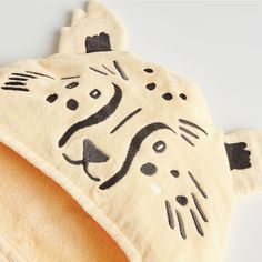 a towel with an animal design on it's face and the words tiger written in black