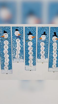 four snowmen with hats on each one are standing in front of the word welcome