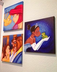 three disney princess paintings hanging on the wall