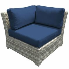 an outdoor chair with blue cushions on it's back and seat cushion in the middle