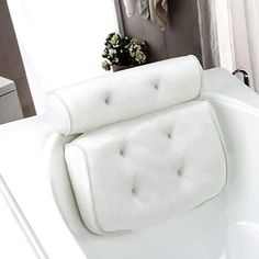 a white bath tub sitting next to a window