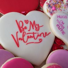 heart shaped cookies with the words be my valentine written on them