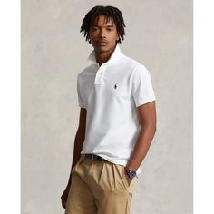 An American style standard since 1972 the Polo shirt has been imitated but never matched. Over the decades Ralph Lauren has reimagined his signature style in a wide array of colors and fits yet all retain the quality and attention to detail of the iconic original. This trim version is made from our highly breathable cotton mesh which offers a textured look and a soft feel. Ralph Lauren Polo Outfit, White Polo Men, Polo Outfit, Slim Fit Polo Shirts, Ralph Lauren Slim Fit, Slim Chinos, Charlotte Bronte, Polo Ralph Lauren Shorts, Slim Fit Polo