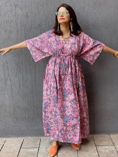 I have a deep fondness for crafting kaftans due to their unmatched comfort. This one is made with hand block printed cotton, adding a touch of uniqueness. It features a drawstring waist with buttons to the waistline, suitable for getting ready, house-wear, or even for expectant mothers. You can also add pockets for an extra $5  www.etsy.com/listing/216227609/add-pockets-to-robeskaftans If you're in between sizes, consider sizing down, as the sizes are quite generous (e.g., Small-Medium fits one size, Large-XL, etc.). The shown length is ankle length, but I can customise it to knee or calf-length based on your height. You can select this option during checkout. Please note that there might be slight color variation due to lighting. Feel free to ask any questions; I'm here to help! Cotton Floral Print Dress With Kimono Sleeves, Cotton Dresses With Floral Print And Kimono Sleeves, Cotton Dresses With Block Print And Kimono Sleeves, Cotton Dress With Floral Print And Kimono Sleeves, Pink Bohemian Cotton Kurta, Bohemian Cotton Dress With Kimono Sleeves, Printed Cotton Dress With Kimono Sleeves, Cotton Maxi Dress With Kimono Sleeves, Traditional Block Print Dress With Kimono Sleeves