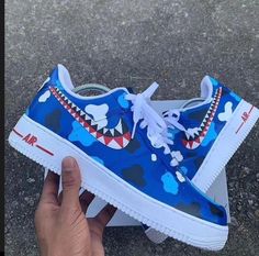 Add a bite of personality to your sneaker game with the Blue Sea Shark Custom Nike Air Force 1. These shoes are sure to make a splash with their unique design and custom details. Don't be afraid to stand out in the sea of boring shoes! Exactly as shown in the pictures. 📷 Brand New & Authentic. 💯 Hand Painted with attention to detail. 👨‍🎨 Waterproof and Flexible. ❤️ Unisex model. Please refer to the Size Chart. 👟👫 Free Worldwide Shipping. ✈️🌍 Sea Shark, Custom Nike Air Force 1, Teeth Design, Custom Nike Air Force, Custom Nike Air, Custom Air Force 1, Blue Shark, Custom Nike, Fresh Shoes